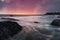 Muscle covered rocks and ocean at sunset