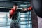 Muscle fighter boxing actively in modern gym