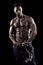 Muscled man on a black background