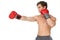 Muscly man wearing red boxing gloves and punching