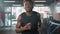 muscular african american man is running on treadmill in gym, portrait shot in fitness center