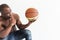 Muscular afro american athlete with basketball ball on white background