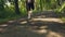 Muscular afro man running in morning through green forest