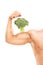 Muscular arm with a broccoli on the bicep