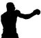 Muscular athlete, professional boxer beats a boxing jab straight punch beats volerkraft with boxing gloves. silhouette