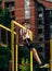 Muscular athletic man working out in park, training and doing pull ups