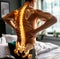 The muscular back of a man is highlighted with a glowing spine graphic, indicating back pain. The combination of