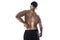 Muscular body sport man holding sore low back waist massaging with his hand suffering pain