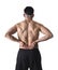 Muscular body sport man holding sore low back waist massaging with his hand suffering pain