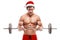 Muscular bodybuilder Santa Claus doing exercises with dumbbells