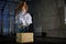 Muscular bride in a wedding dress doing exercises on a wooden box in the gym