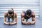 Muscular couple doing planking exercises