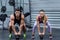 A muscular couple lifting kettlebells