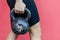 Muscular crossfit woman holding old and rusty kettle bell