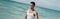 Muscular cuban young man walking ocean