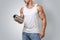 Muscular fitness male holding protein shake bottle