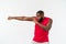 Muscular man of African descent isolated over a white background showing a closeup of his fists and knuckles. Shallow