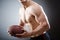 The muscular man with american football