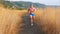 Muscular man do cardio exercise running outdoors