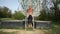 Muscular man doing pull-ups on gymnastics rings