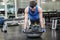 Muscular man doing push up with bosu ball