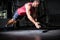 Muscular man doing push-ups with hand clapping