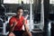 muscular man hold water to drink in gym