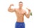 Muscular man holding a carrot and showing bicep