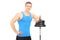 Muscular man leaning on a barbell