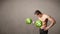 Muscular man lifting green dollar sign weights