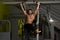 Muscular Man Performing Hanging Leg Raises Exercise