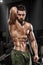 muscular man posing in gym, shaped abdominal. Strong male naked torso abs, working out