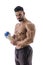 Muscular man posing with protein shaker