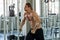 Muscular man pumping up muscles chest with cable crossover at gym in morning light .workout , exercises , bodybuilder training ,