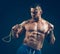 Muscular man skipping rope. Portrait of muscular