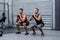 Muscular men exercising with kettlebells