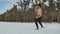 Muscular naked athlete training in the winter field