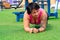 Muscular plump woman exercising on the sports ground