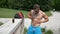 Muscular Shirtless Hunk Man Applying Sunscreen