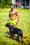 Muscular shirtless man with dobermann dog