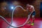 Muscular Shirtless Man in a Gym Exercises with Battle Ropes During His Fitness Workout High-Intensity Interval Training.