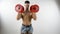 Muscular shirtless young man exercising with dumbbells