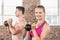 muscular smiling couple with kettlebells