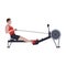 Muscular sportsman training on the rowing machine concept. CrossFit workout. Healthy fitness body shape man motivation.