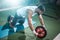 Muscular sportsman working out with fitness wheel at gym