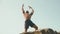 Muscular strong black bodybuilder posing on the rock against blue cloudy sky. Perfection of human\'s body