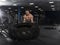 Muscular,Strong bodybuilder pushing tire in modern fitness cente