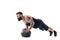 Muscular tattooed bearded male exercising fitness weights Medicine Ball push ups exercises in studio isolated on white