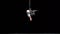 Muscular white circus artist on the aerial straps on black background in slowmotion. Movement and motion concept