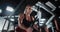 Muscular woman bodybuilder is training in the gym